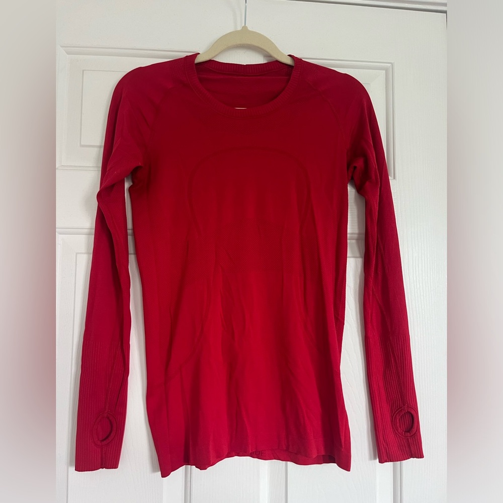 Lululemon swift stride. Barely worn, small pill on back inside of shirt. Size:8